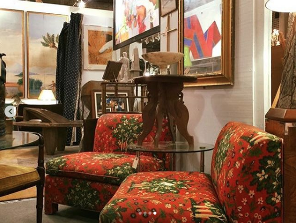 Heather Karlie Vieira at the Antique and Design Center during High Point Furniture Market with the 20th Century abstract shaped canvas by Canadian artist Reginald Holmes painitng